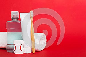 Mouthwash and other oral hygiene products on colored table top view with copy space. Flat lay. Dental hygiene. Oral care