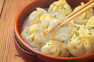 Mouthwatering manti dumplings showcased elegantly against wooden backdrop