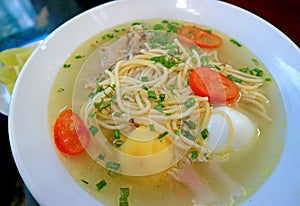 Mouthwatering Peruvian Spicy Chicken Noodle Soup or Caldo de Gallina soup photo