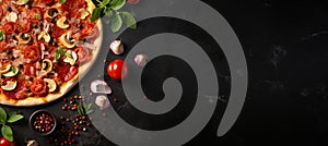 Mouthwatering pizza on black stone, top view with fresh ingredients, empty space for text