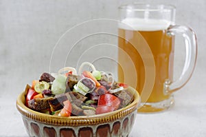 Mouthwatering salad and a glass of beer