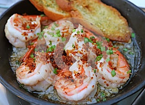 Mouthwatering Spanish Style Garlic Shrimp or Gambas al Ajillo in a Hot Pan photo