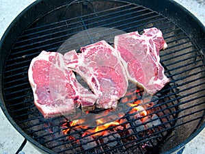 Mouthwatering T-Bone Steaks on photo