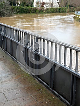 Movable dam on bridge railing to prevent river flooding and inundation photo