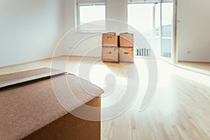 Move. Cardboard, boxes for moving into a new, clean and bright home