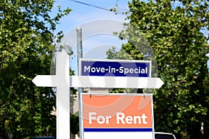 Move In Special and For Rent real estate signs advertise enticing incentive for apartment, condo or home renter