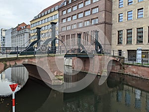 Moveable bridge over a small canal in east Berlin photo