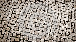 Movement along the pavement, top view. Urban paving slabs