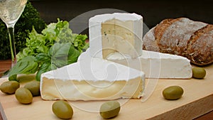 Movement of the camera around of French brie cheese with bread