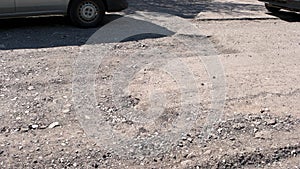 Movement of car on damaged road.