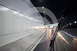 Movement in car inside tunnel of modern city