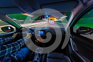 Movement of the car at night at a speed view from the interior, Brilliant road with lights with a car at high speed