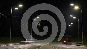 The movement of cars on the city road, car lights, time lapse