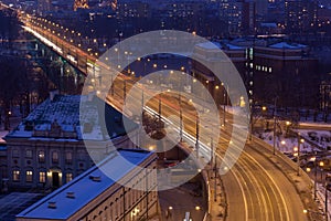 Movement of cars on the night street in Warsaw