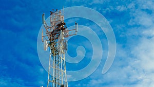 Movement of clouds on a background of an iron tower. Time lapse video.