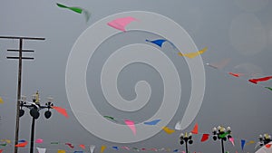 Movement of colorful flags and Stormy Clouds with Sky