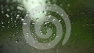 Movement of Rain falling on car windshield