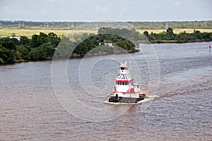 The movement of sea merchant ships and tugs to the entrance and exit from the port. Beaumont, Texas