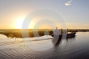 The movement of sea merchant ships and tugs to the entrance and exit from the port. Beaumont, Texas