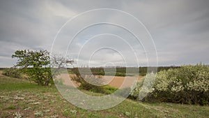 The movement of the thunderclouds over the fields of winter wheat in early spring in the vast steppes of the Don.