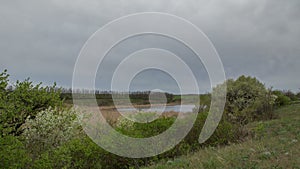 The movement of the thunderclouds over the fields of winter wheat in early spring in the vast steppes of the Don.