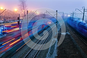 Movement of trains in the ways of evening twilight fog Spring