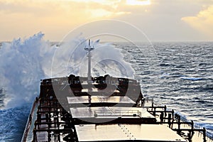 The movement of the vessel against the waves during a heavy storm. Sunset.North Pacific ocean.