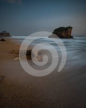 The movement of the waves on the shore