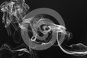 Movement of white smoke on dark background