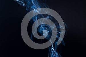 Movement of white smoke on dark background