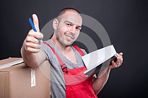 Mover guy holding agenda making thumb up gesture