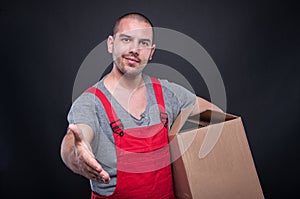 Mover guy holding box offering hand shake