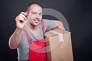 Mover guy holding box writing with red marker