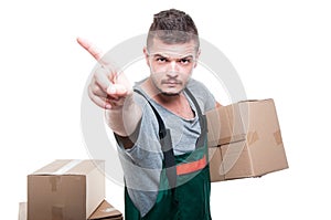 Mover guy holding cardboard box showing denial gesture