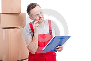 Mover guy making thinking gesture and holding clipboard