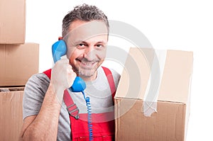 Mover man holding box and big telephone receiver