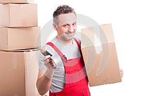 Mover man holding box cutter and duct tape