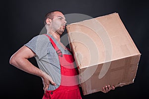 Mover man holding box having back pain