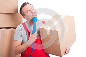 Mover man holding telephone receiver looking for idea