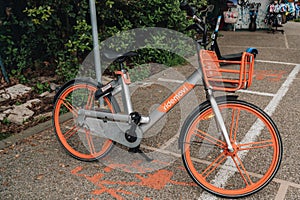 Movi rental bike parked on a street on Lido Island, Venice, Italy