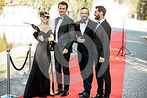 Movie actors on the red carpet outdoors