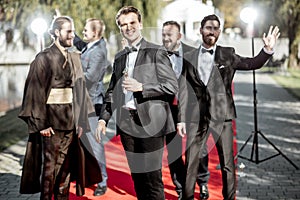 Movie actors on the red carpet outdoors