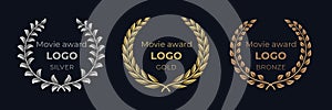 Movie award logo. Laurel golden emblems, winner reward foliage banner, show prize luxury concept. Vector golden wreath