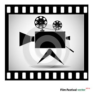 Movie camera at film strip isolated on a white background. stock vector illustration.