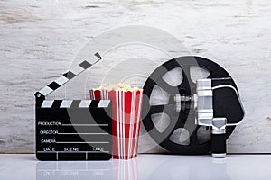 Movie Camera With Popcorn And Clapper Board