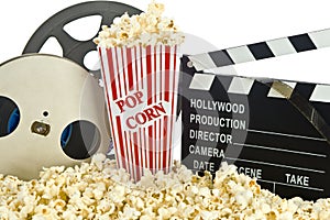 Movie Clapper Board in popcorn with film reel