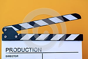 Movie clapper isolated on yellow background