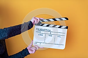 Movie clapper isolated on yellow background