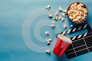 Movie Clapper, Popcorn, and Red Cup on Blue Background