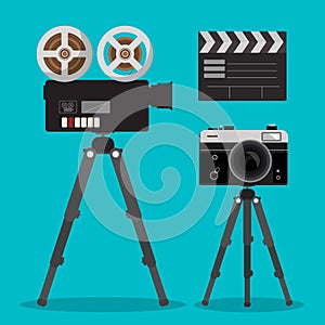 Movie and Photo Film Cameras Set on Tripods.